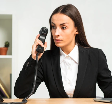 woman while talking on telephone